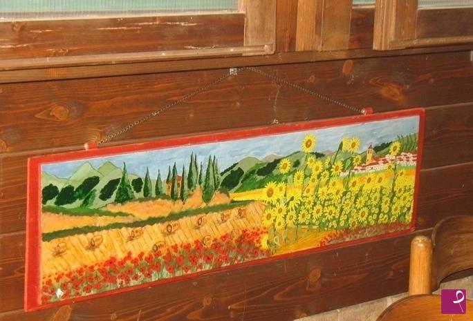 quadri in vendita online - campo di girasoli-e grano appena mietuto paesaggio toscano